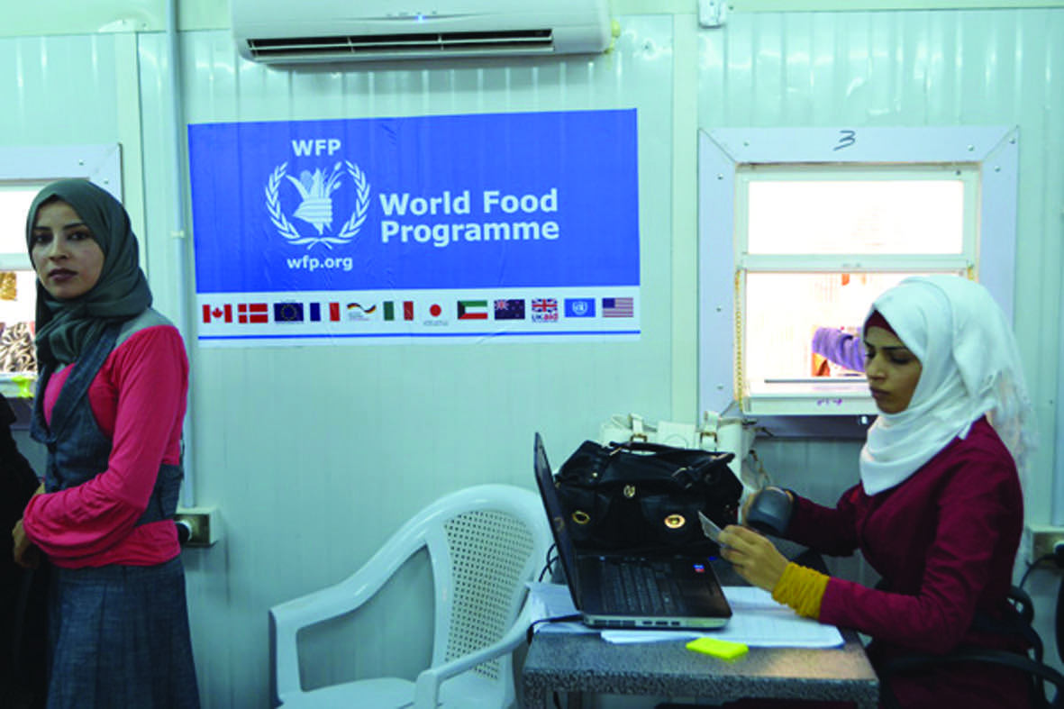 ECHO and WFP provide food vouchers to Syrian refugees in Jordan, Save the Children manages distribution at Zaatari camp.