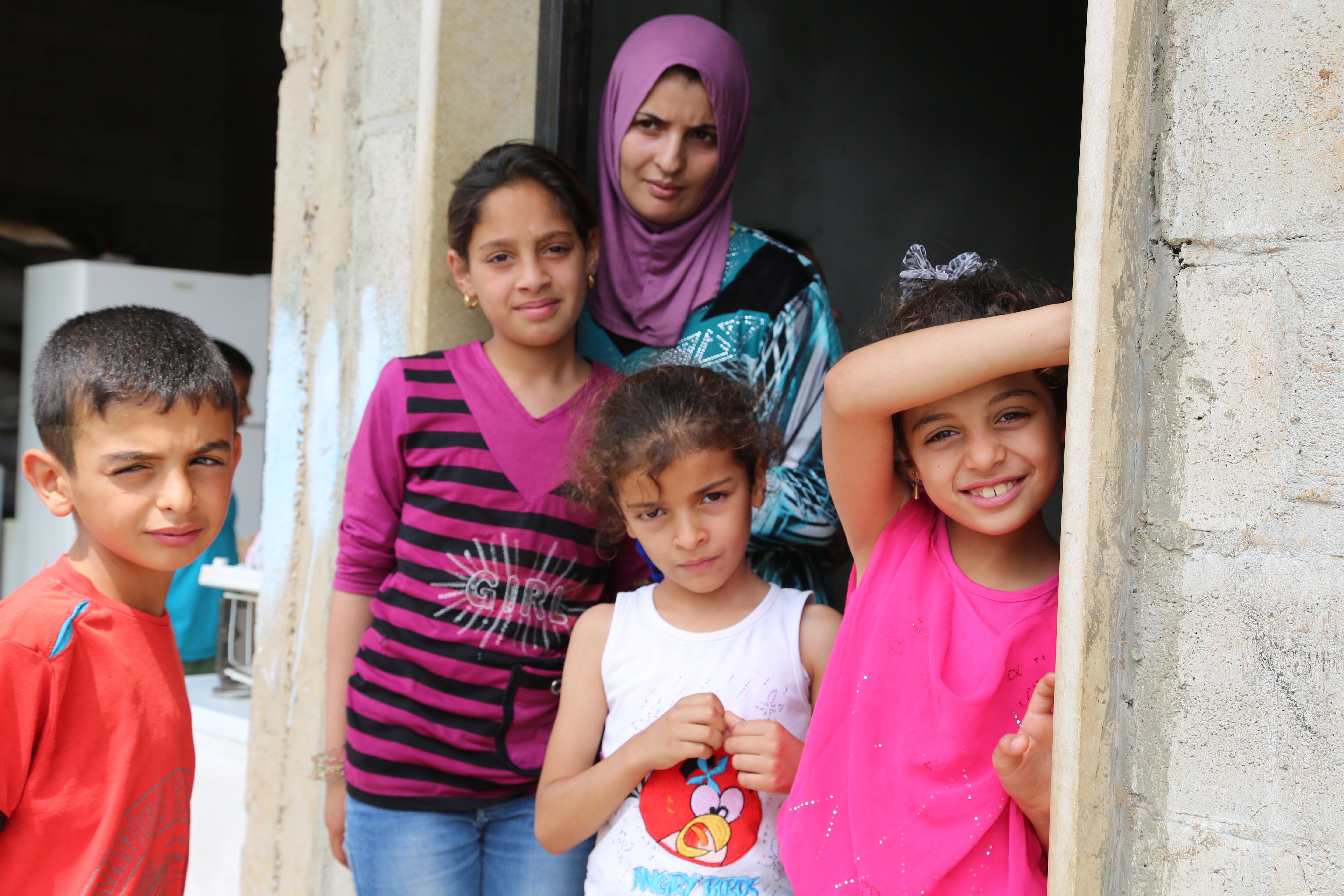 Fatmeh, a 26-year old Syrian refugee mother and her children in Wadi Khaled in North Lebanon