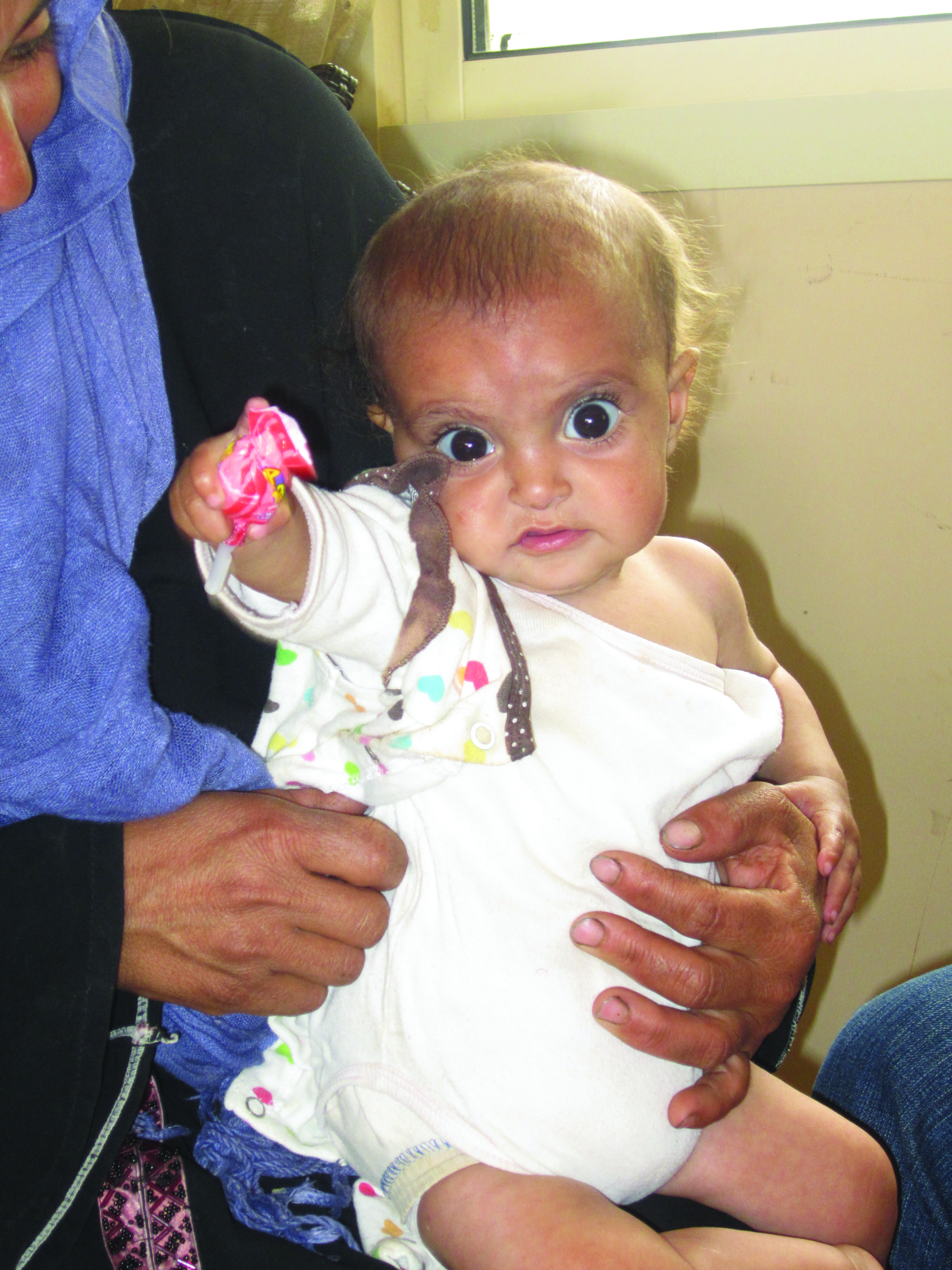 An infant in an informal tented settlement in Saida, Lebanon