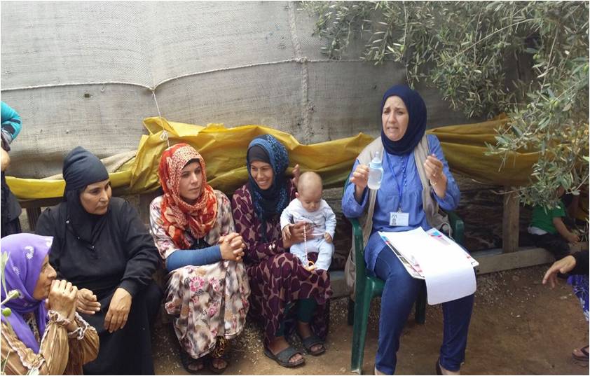 A community health worker provides an awareness session to women about breastfeeding in Akkar region