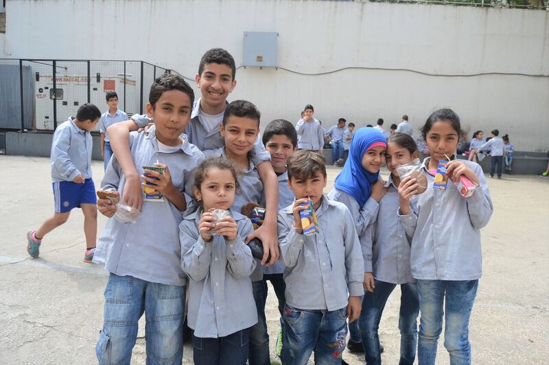 Students enjoy their healthy snack during the recess at a school in Mount Lebanon