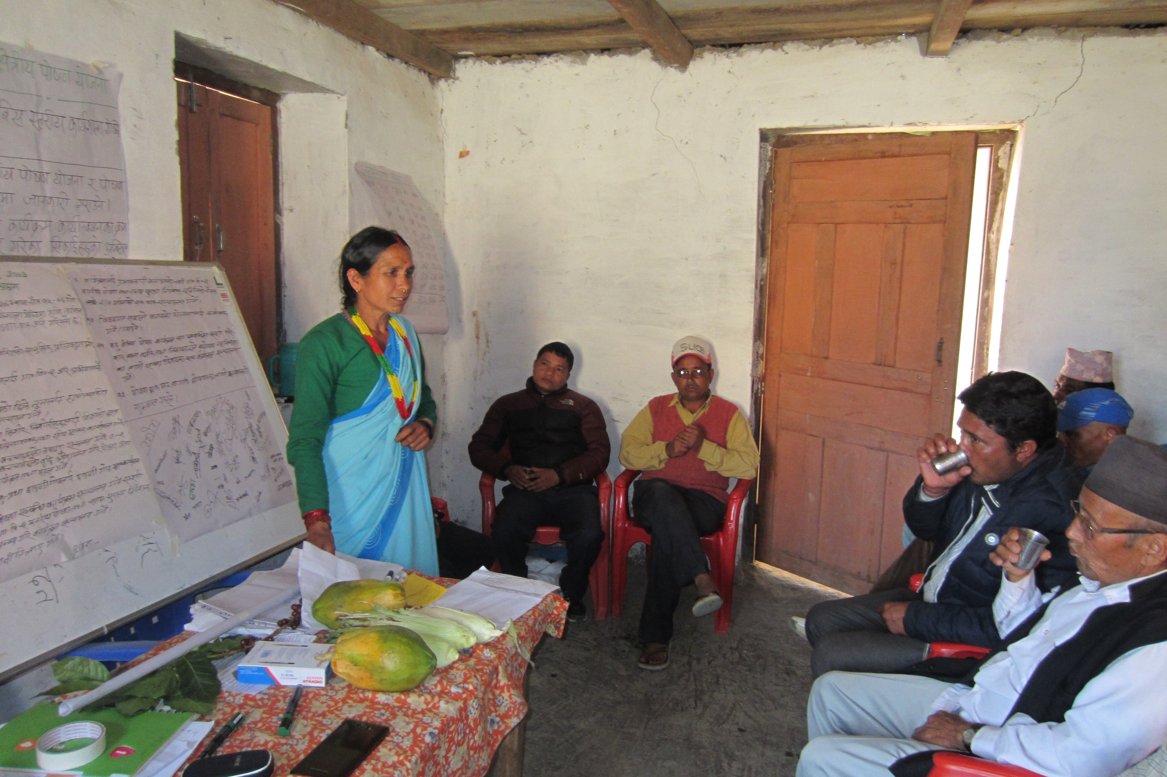 A female community health volunteer shares her experience of implementing nutrition activities during an advocacy workshop in Achham district  