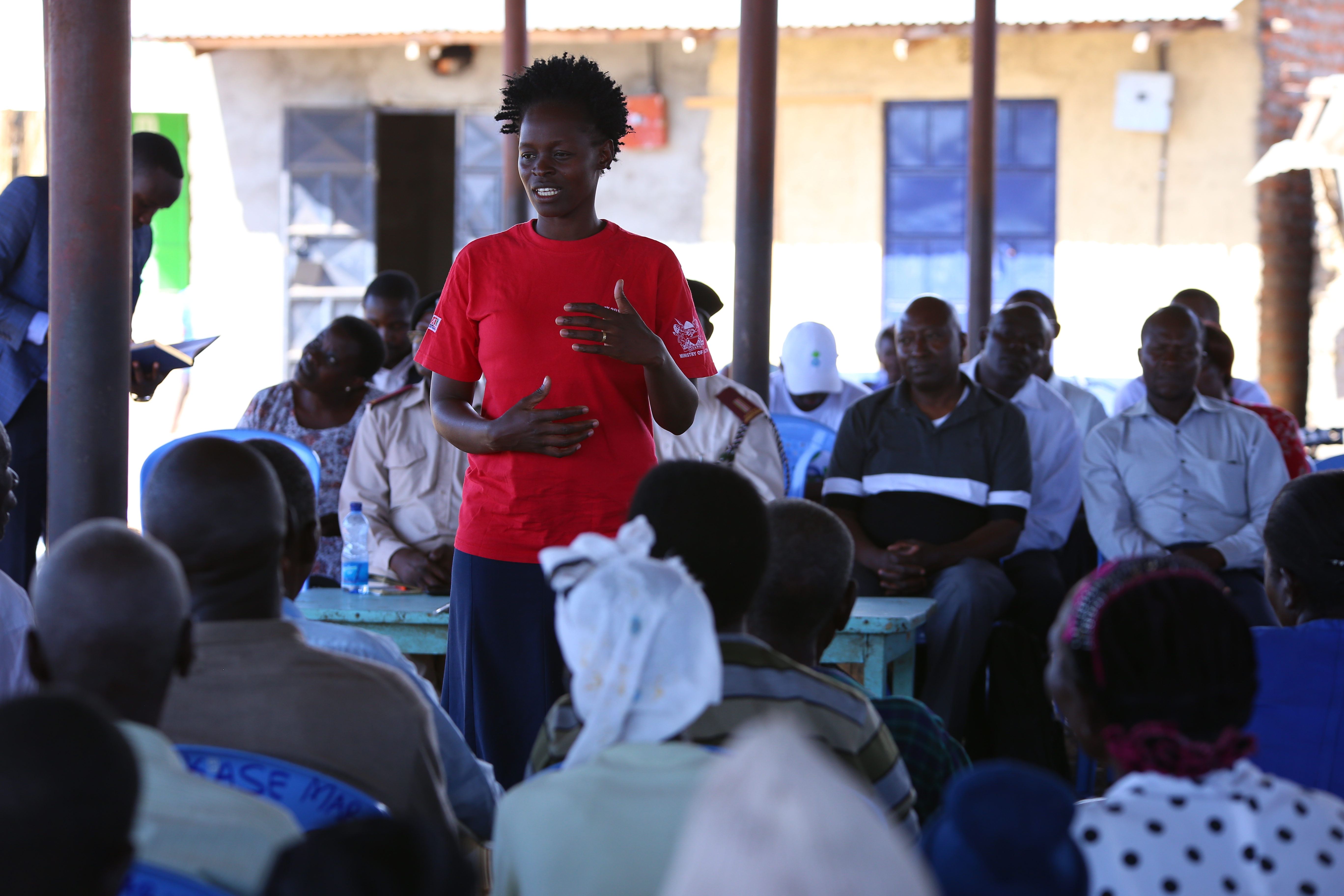 Community Health Volunteer giving a health talk during a community dialogue day