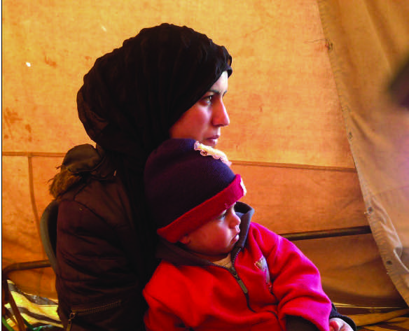 Syrian refugee and her child