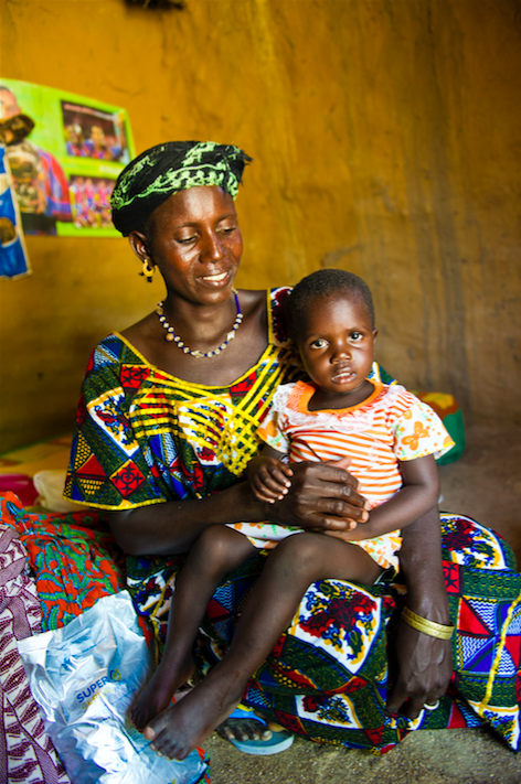 A woman and her child enrolled in a targeted supplementary feeding programme in Damdégou, Burkina Faso, 2012