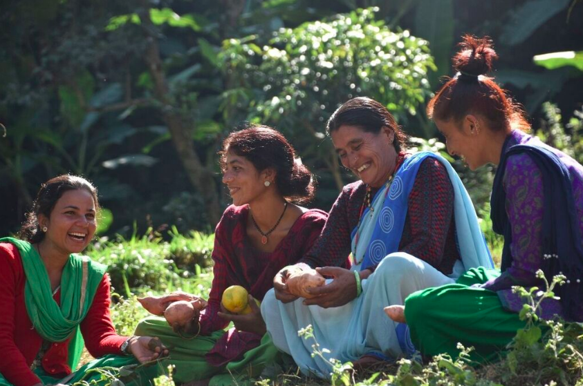 Women discussing iron rich orange fleshed sweet potato with a community health volunteer, Prasiddha, 2017