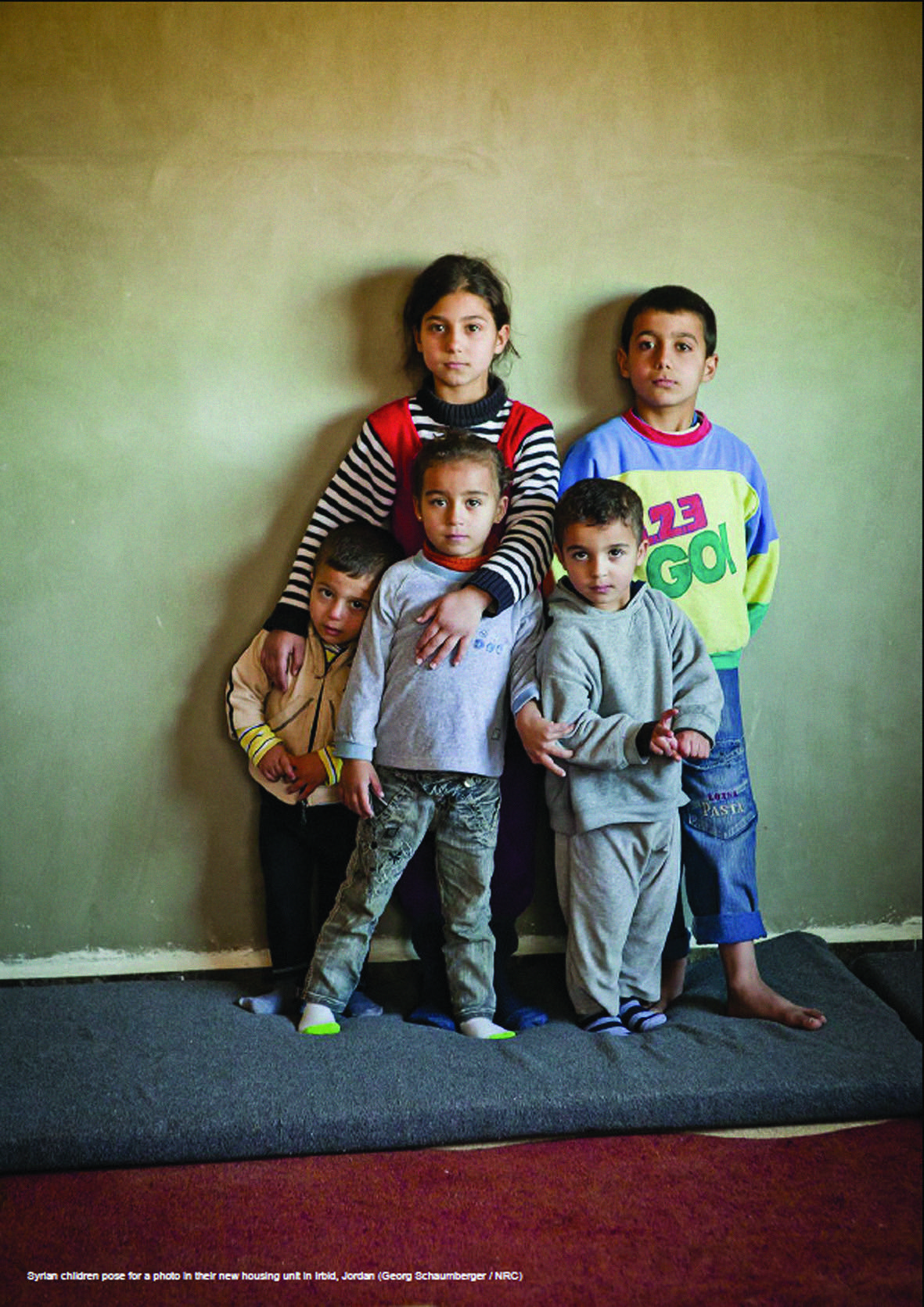 Syrian children in their new housing unit in Irbid, Jordan