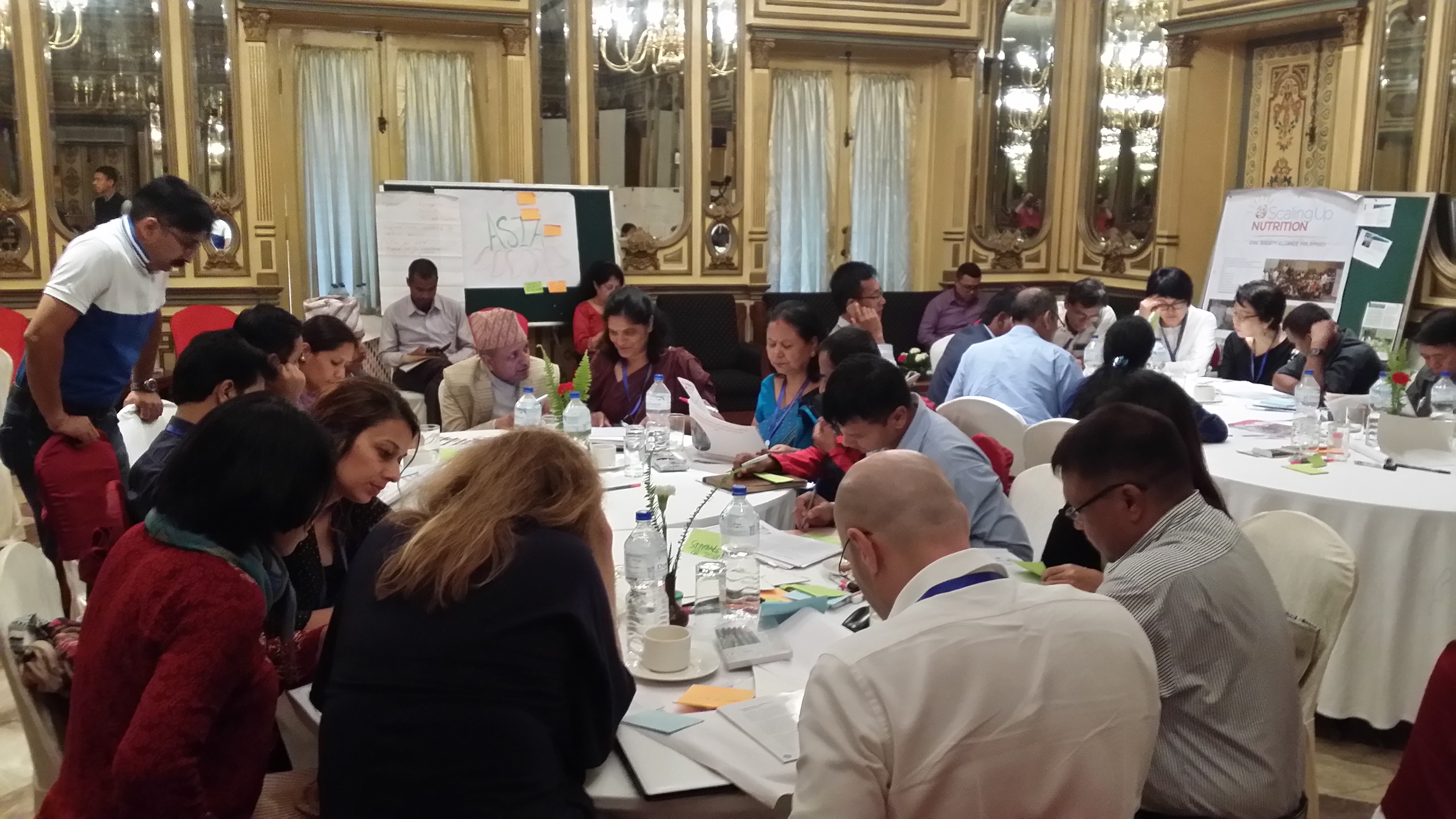 Picture of people sitting around tables at the SUN Civil Society Regional Learning Exchange in 2017.