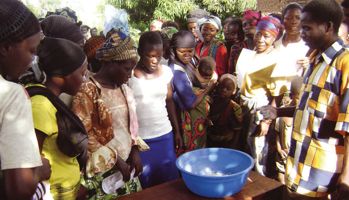 Villagers learning about the first stage of the wetting process