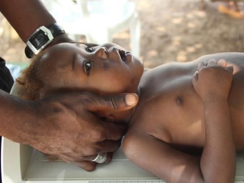 FB a child lying down receives medical attention