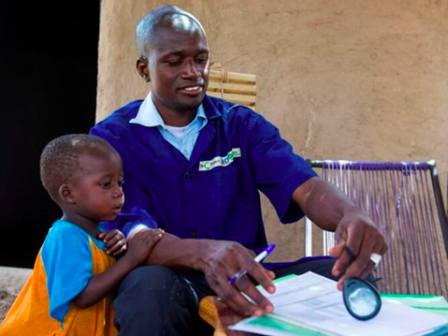 FB Famakan Kiabou the community health worker in Kourounan checks the medical records of Samakoun Mali
