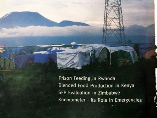 Front cover of issue titled, "Special focus: Supplementary feeding in emergencies." The image shows a camp base with mountains in the background