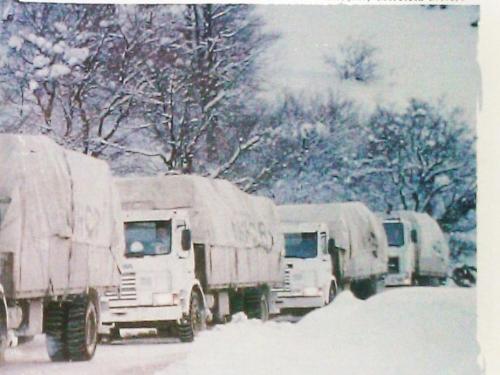 Front cover image shows a convoy of lorries in the snow