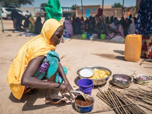 A woman preparing a meal in Rafa, Niger