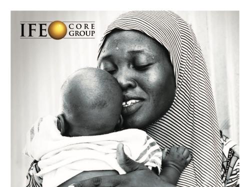 Front cover of report titled, "Infant Feeding in Emergencies Core Group, 2020 Annual Meeting Report." 4 – 12 November 2020, Virtual Meeting. Image shows woman holding a baby to her chest.
