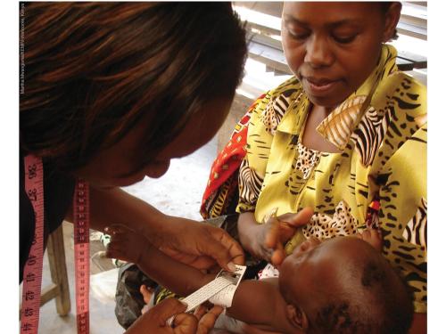 Front cover of report titled, "A review of methods to detect cases of severely malnourished infants less than 6 months for their admission into therapeutic care." Image shows a healthcare worker measuring a baby's arm.
