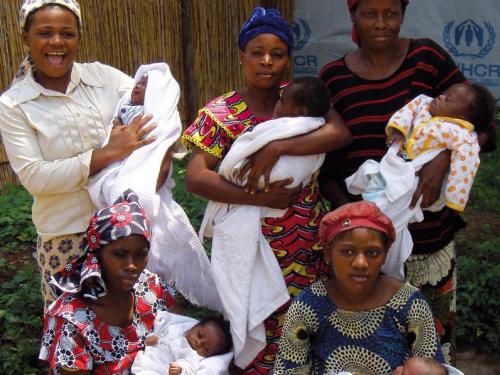 Photo of five women and their babies taken from the first page of MAMI Project Summary Report 2009