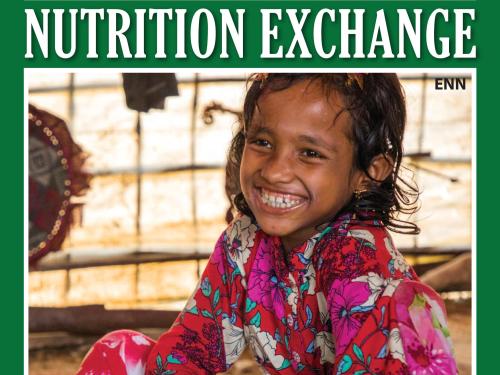 Front cover of Nutrition Exchange English version of issue 10. Image shows a young girl eating from bowl and smiling.