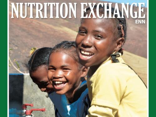 Front cover of issue 4 English version of Nutrition Exchange. Image shows three girls washing their hands.