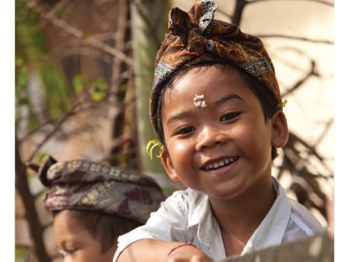 Front cover of document titled, "Technical Briefing Paper: The relationship between wasting and stunting: policy, programming and research implications." Image shows a child with rice grains stuck on their head.