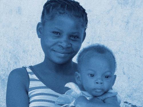 Front cover of MAMI project technical review showing woman holding baby