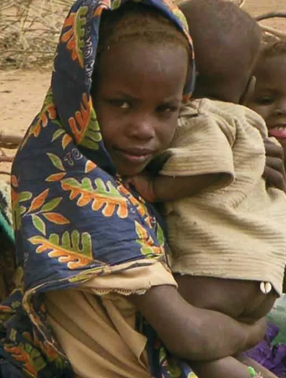 Front cover image shows a group of children, with one of the children holding a baby