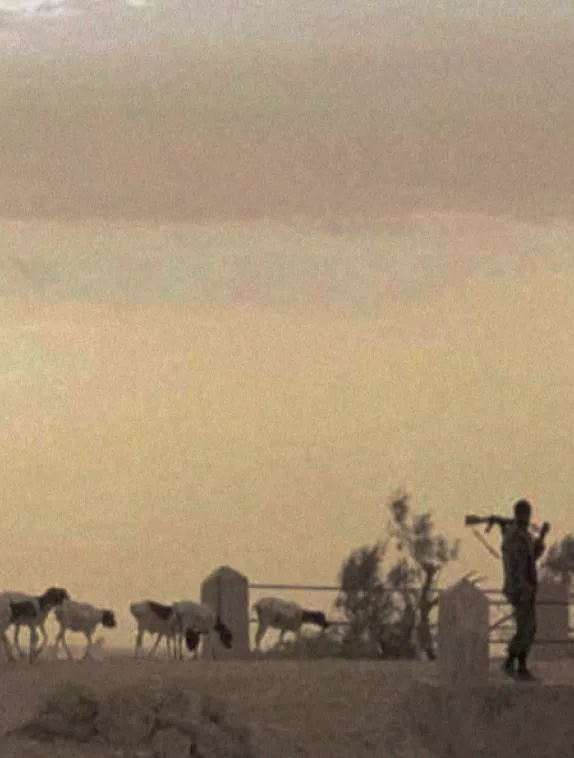 Front cover image shows a farmer walking with his goats