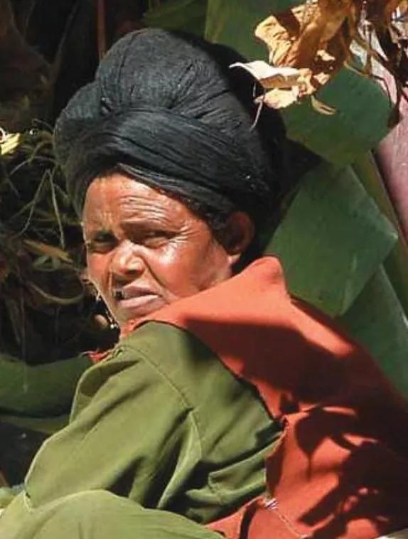 Front cover shows a picture of woman working in a crop field