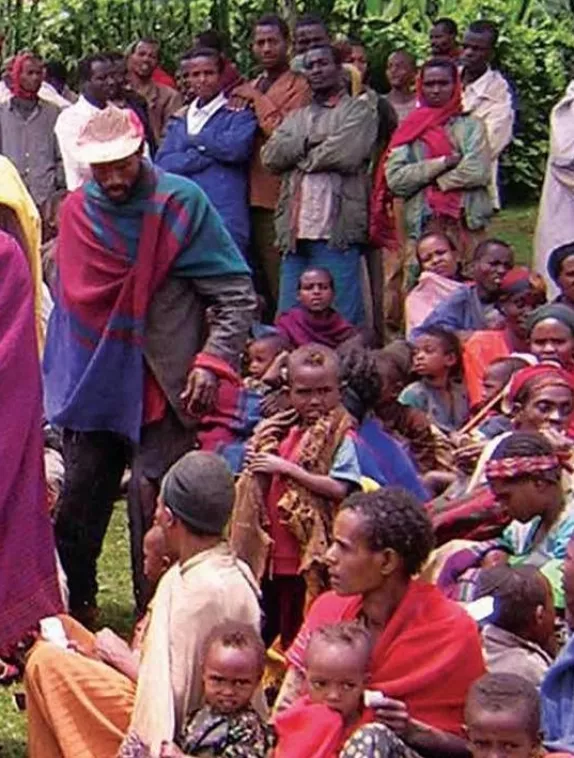 Front cover image shows a gathering of people including men and children