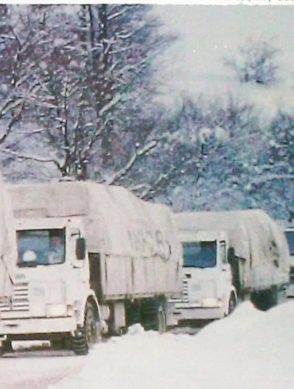 Front cover image shows a convoy of lorries in the snow