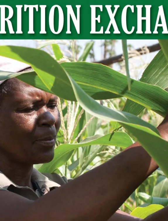 Front Cover of Nutrition Exchange Journal Issue 5 showing the face of a woman in a crop field