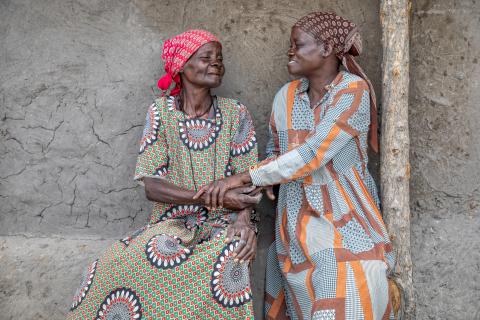 Two elderly woman smiling together