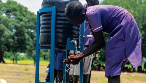 Girl cleaning her hands.