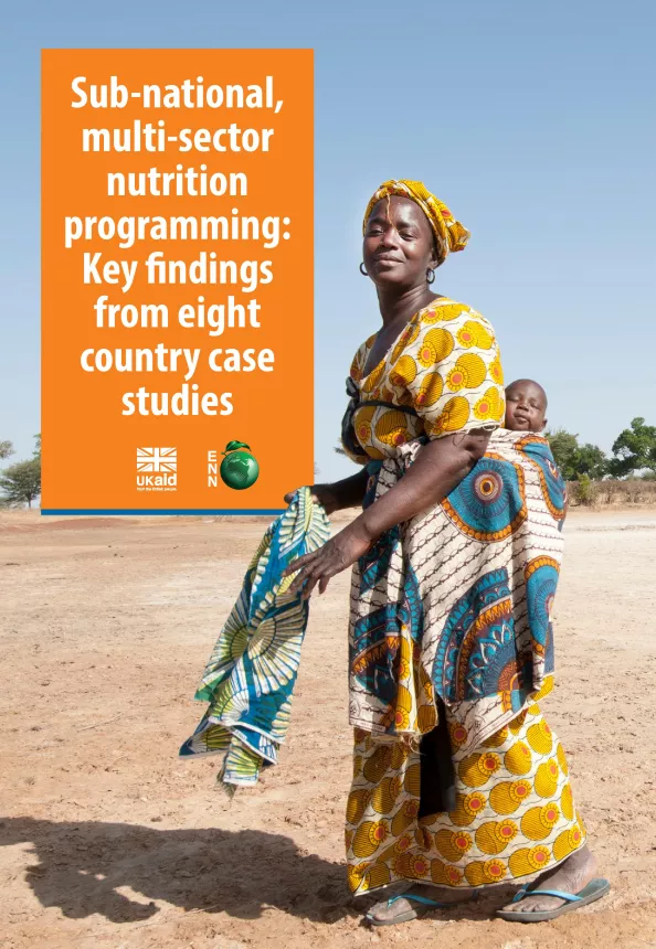 Front cover of case study titled, "Sub-national, multi-sector nutrition programming: Key findings from eight country case studies." The image shows a woman walking in a field with a baby strapped to her back. 
