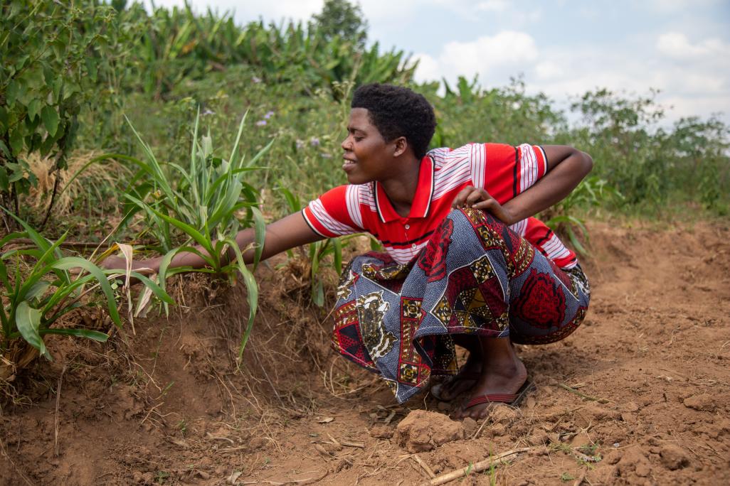 Merankebandi participant tending to her kitchen garden. Burundi, 2021