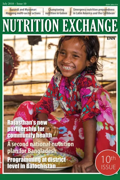 Front cover of Nutrition Exchange English version of issue 10. Image shows a young girl eating from bowl and smiling.