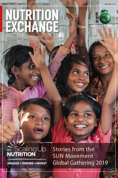 Front cover of Issue 13 English version titled, "Stories from the SUN Movement Global Gathering 2019." The image shows young girls smiling with their hands in the air.