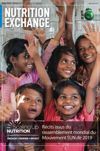 Front cover of Issue 13 French version titled, "Stories from the  SUN Movement Global Gathering 2019." The image shows young girls smiling with their hands in the air.