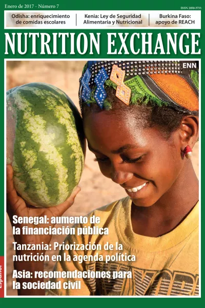 Front cover of issue 7 Spanish version of Nutrition Exchange. Image shows a a girl smiling and holding a watermelon. 
